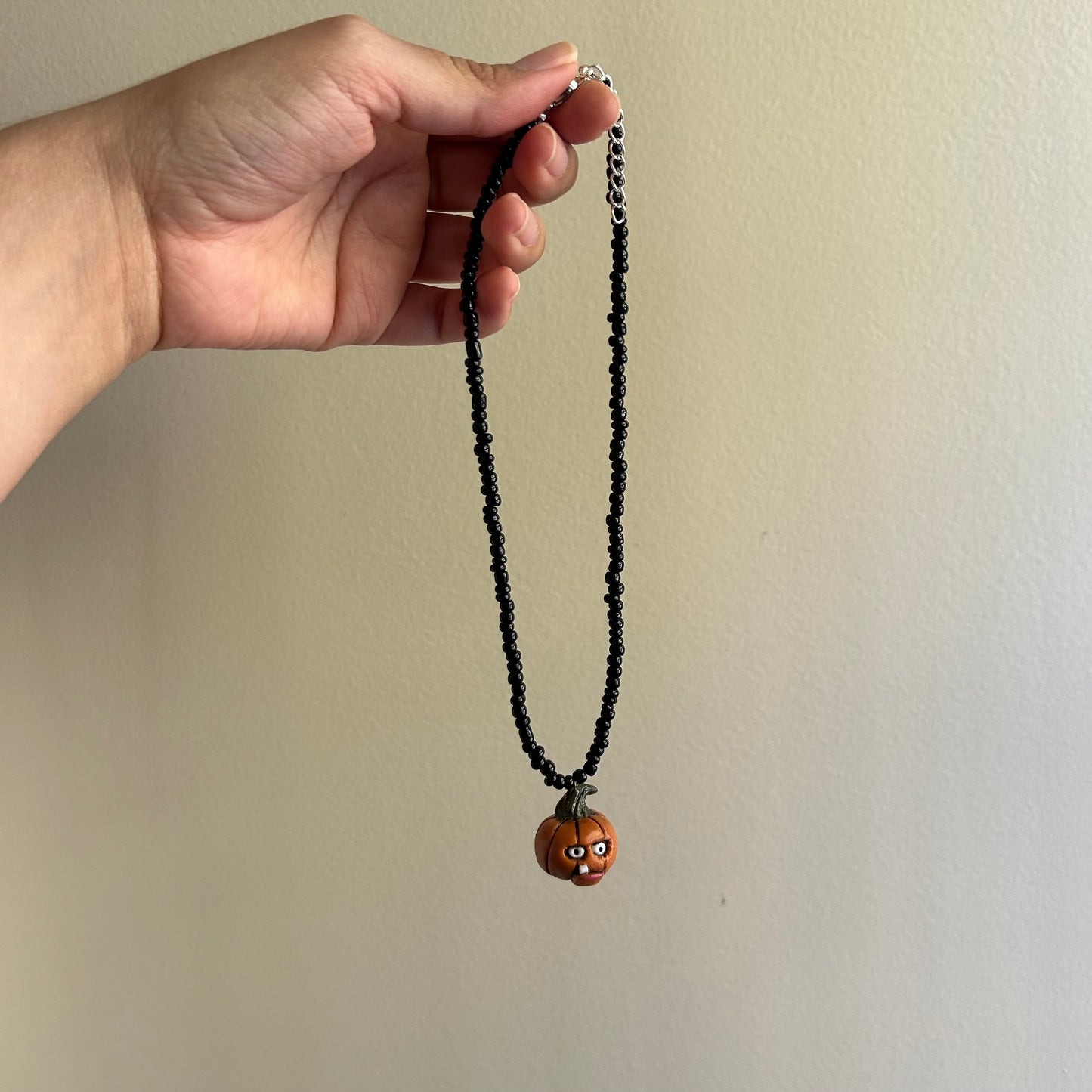 Goofy Toothy Pumpkin Beaded Necklace